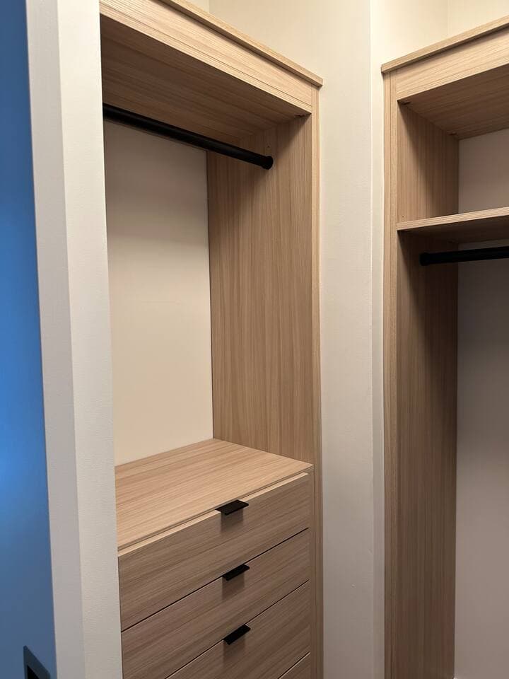Custom built in closet in bunk bedroom room