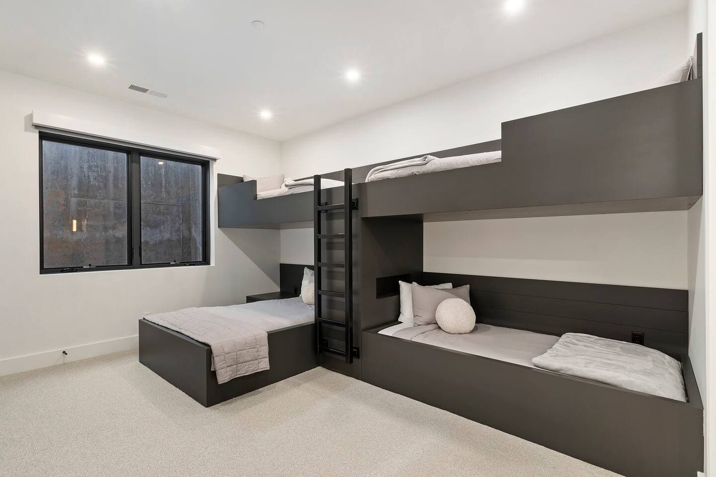 Bunk Bed Room located on 1st level. One full size bed, 3 twin size beds. Ensuite bathroom. 