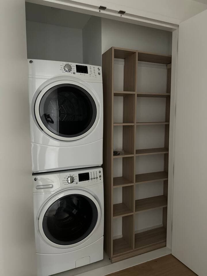 In home washer and dryer with convenient storage shelves for comfort and ease.