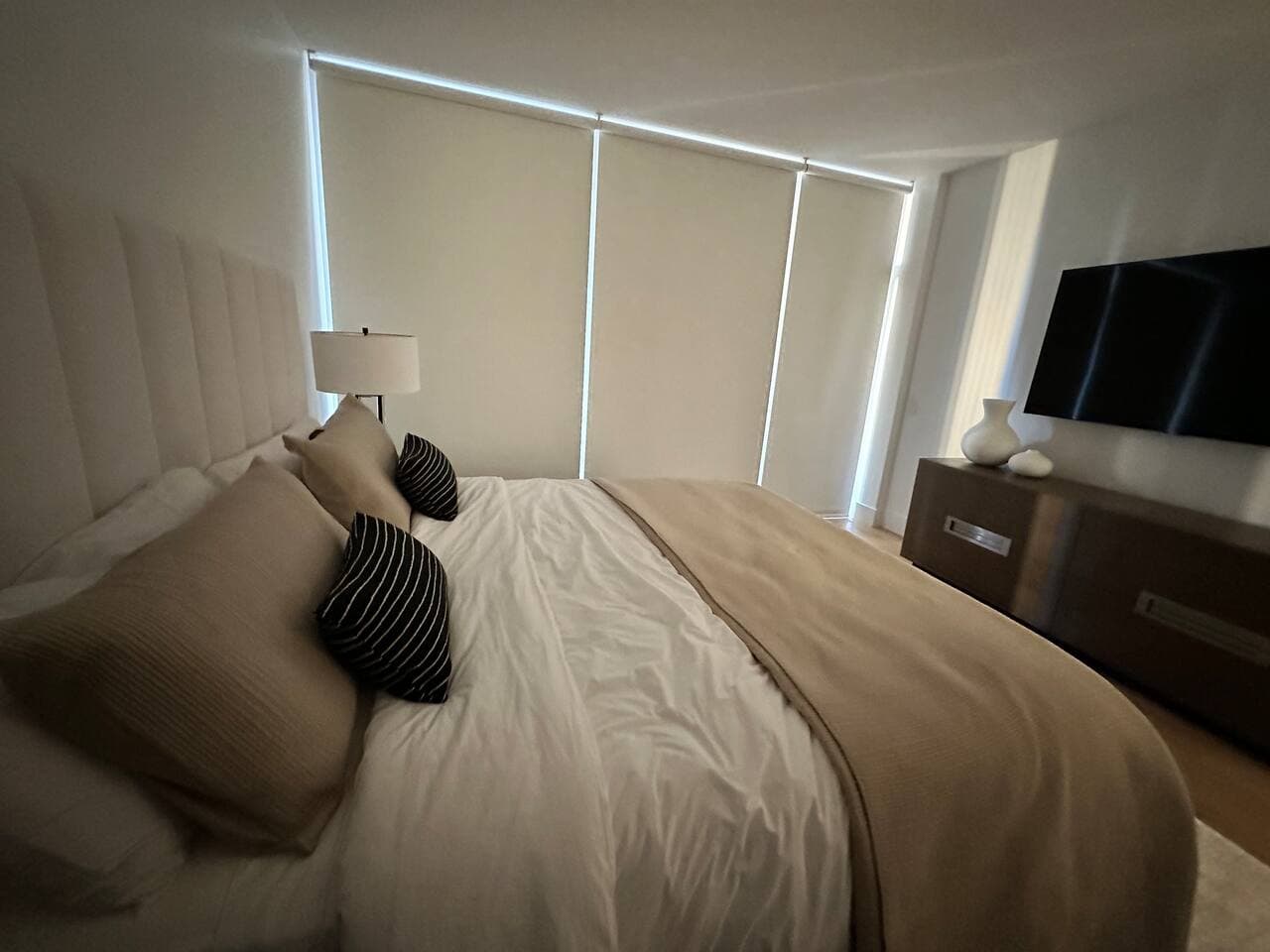 Primary Bedroom with blackout shades for privacy and a good night's sleep