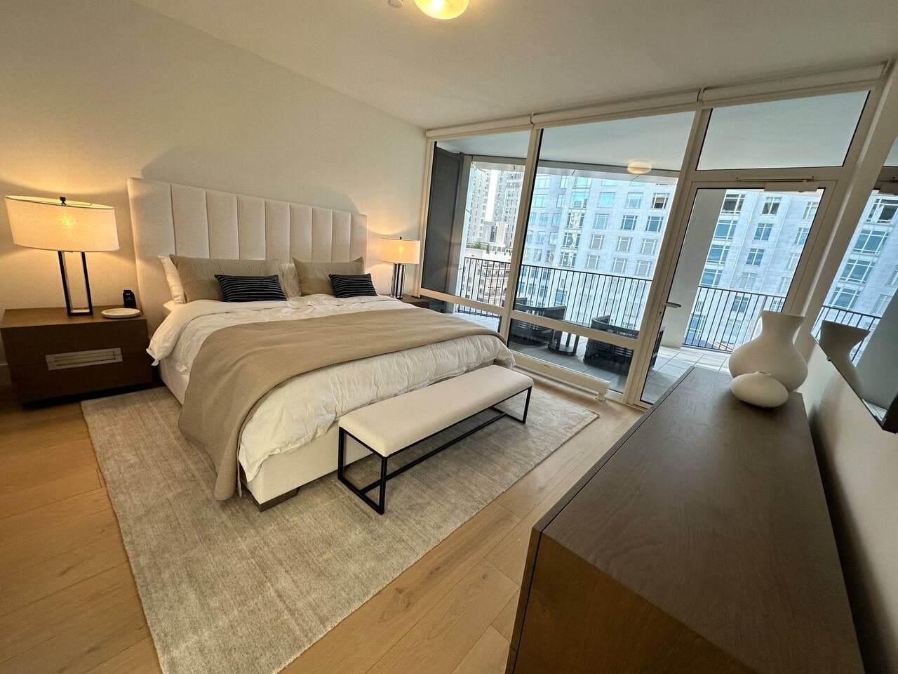 Primary bedroom with king bed, with access to a private balcony